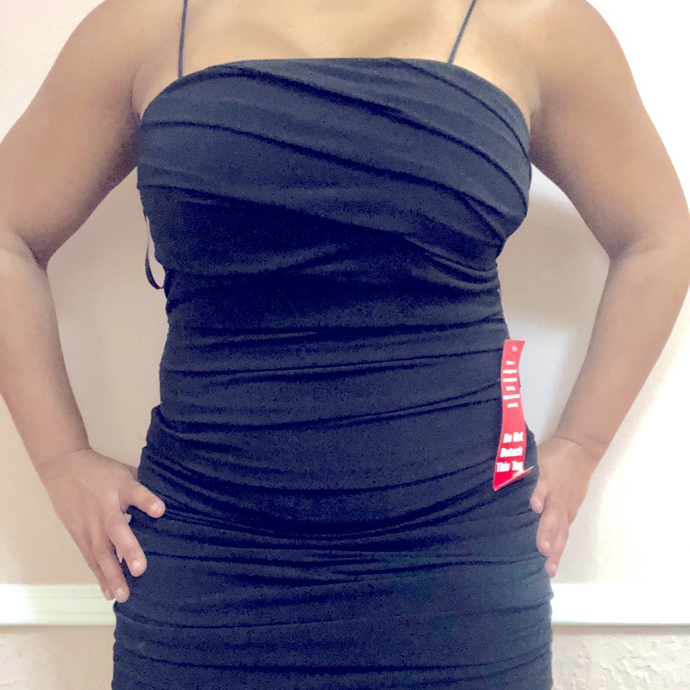Full body rouching flattering dress.